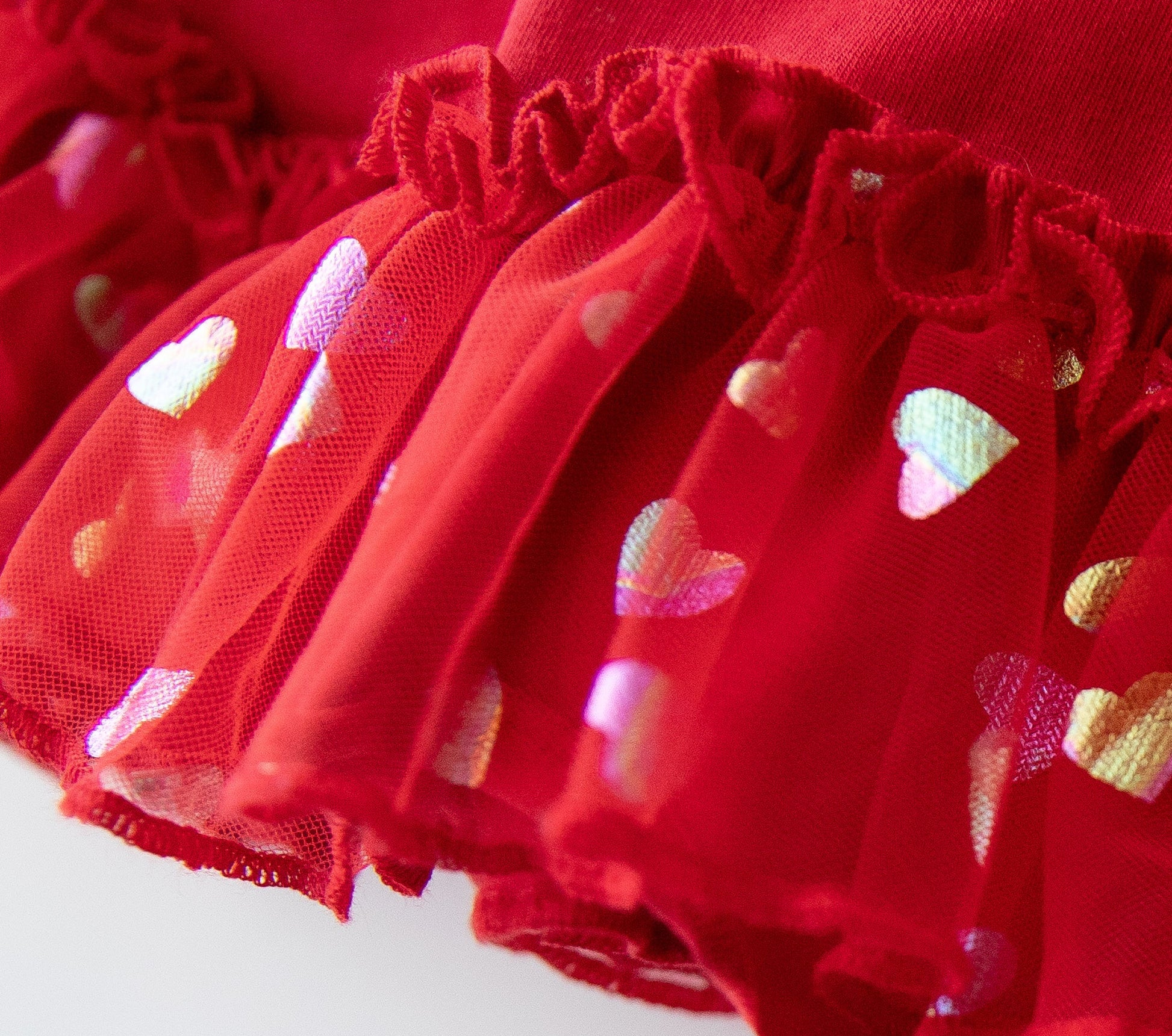 Red fabric with heart patterns on a white background